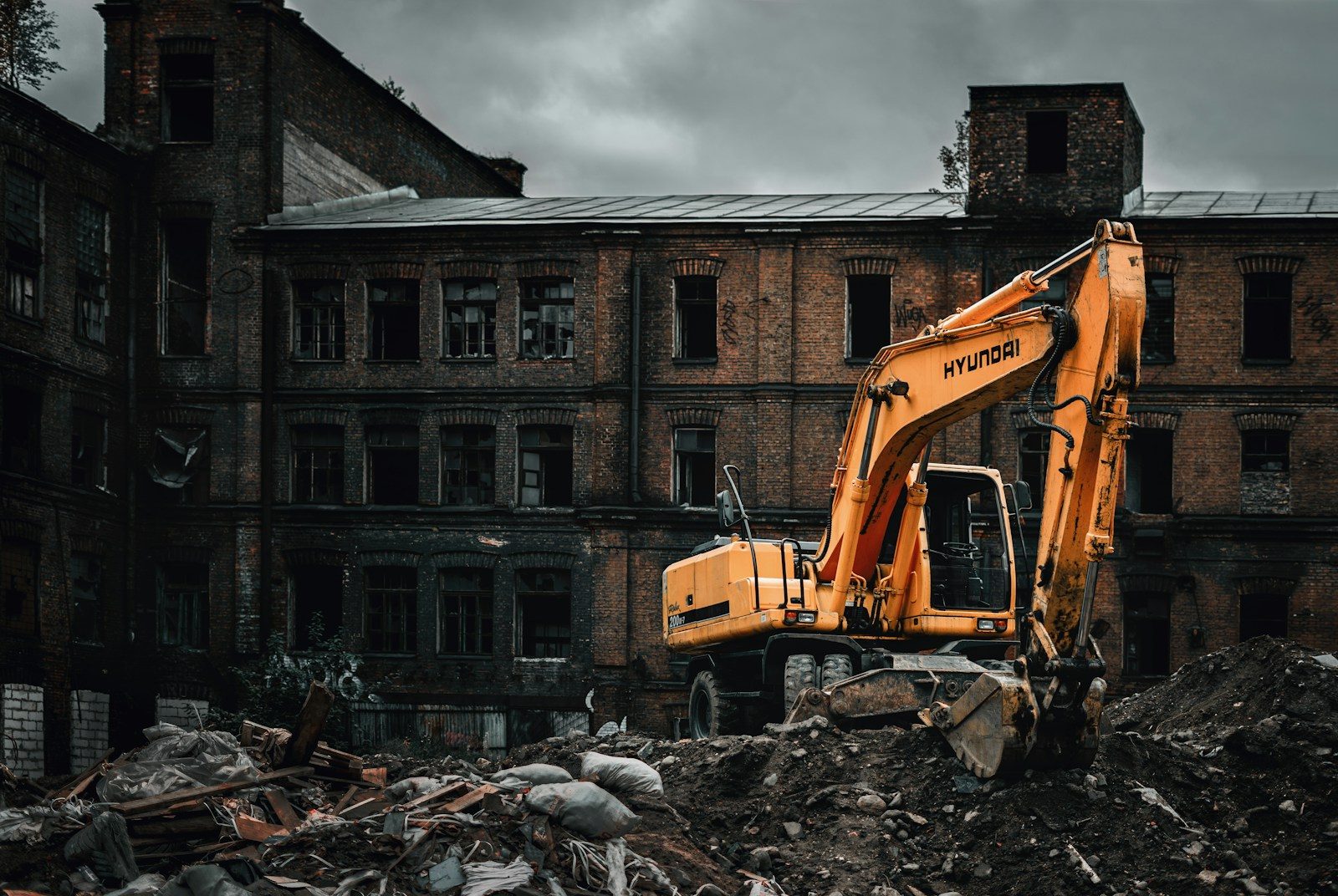 Excavator demolishing a structure